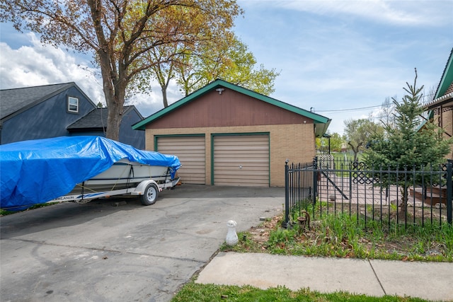 detached garage with fence