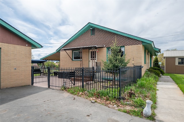 bungalow featuring brick siding and fence private yard