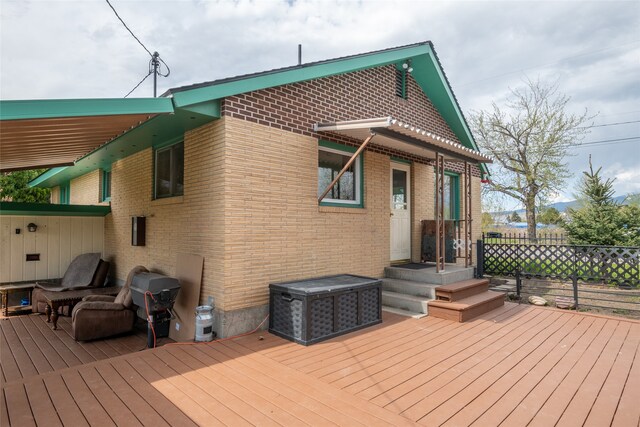 wooden deck featuring fence
