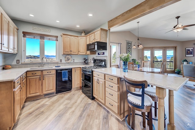 kitchen with a kitchen breakfast bar, a sink, black appliances, light brown cabinets, and vaulted ceiling with beams