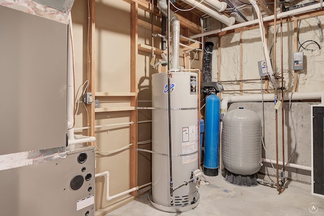 utility room featuring heating unit and secured water heater