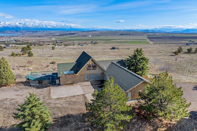 drone / aerial view featuring a rural view and a mountain view