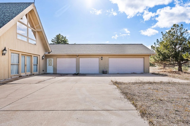 garage with concrete driveway