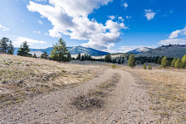 mountain view featuring a rural view