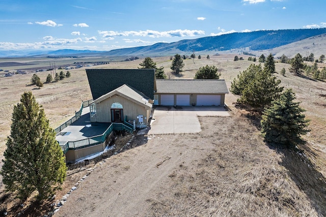 birds eye view of property featuring a rural view and a mountain view