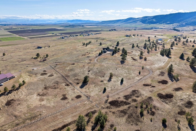 bird's eye view featuring a rural view and a mountain view