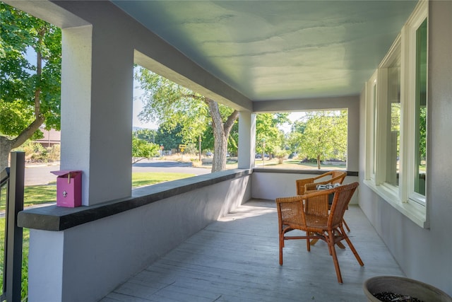 sunroom with hardwood / wood-style floors