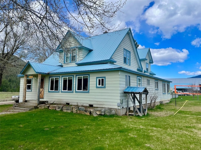 exterior space with a yard and metal roof