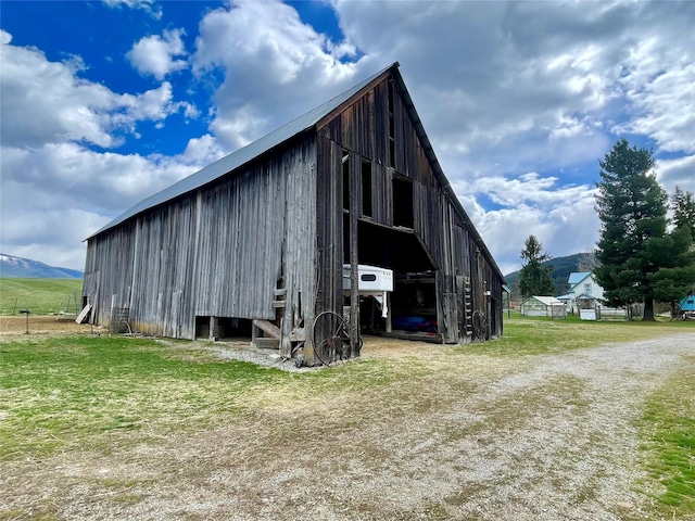 view of pole building with a mountain view