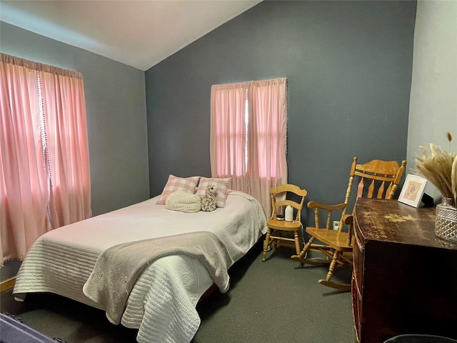 carpeted bedroom featuring lofted ceiling