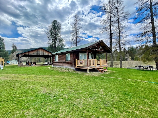 view of property exterior featuring a lawn, log siding, metal roof, and a wooden deck