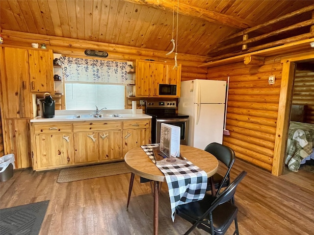 kitchen with open shelves, black microwave, a sink, freestanding refrigerator, and stainless steel electric stove