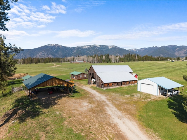 birds eye view of property with a rural view and a mountain view