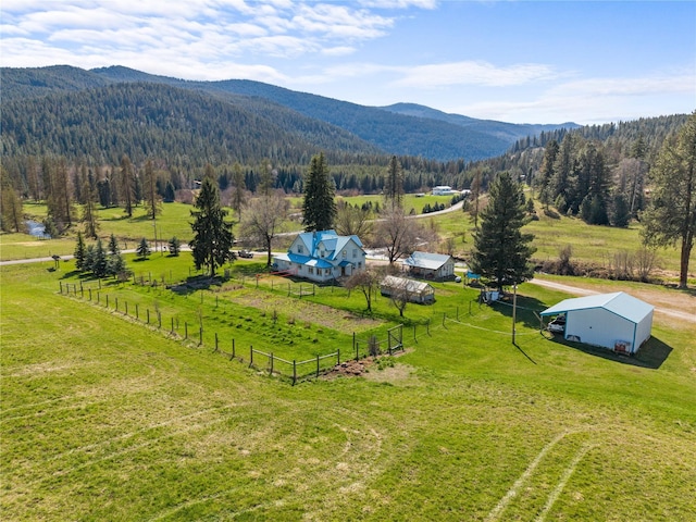 bird's eye view featuring a forest view, a rural view, and a mountain view