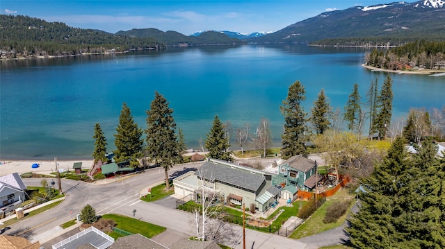 drone / aerial view with a water and mountain view