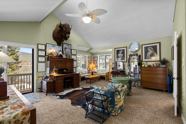 living area with carpet, ceiling fan, and high vaulted ceiling