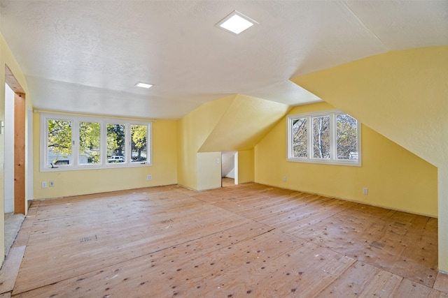 226 S Davis St, Missoula, MT 59801 - bonus room featuring hardwood / wood-style floors, lofted ceiling, and healthy amount of natural light