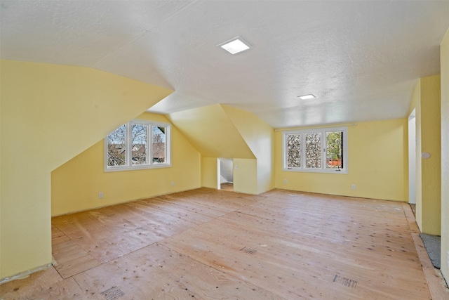 226 S Davis St, Missoula, MT 59801 - bonus room featuring a textured ceiling, wood finished floors, and lofted ceiling