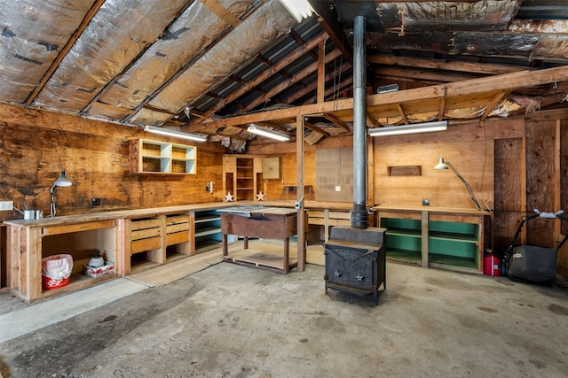 226 S Davis St, Missoula, MT 59801 - garage featuring a workshop area and a wood stove