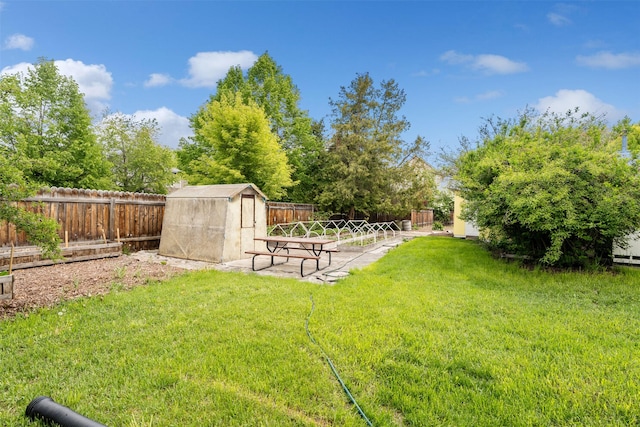 226 S Davis St, Missoula, MT 59801 - fenced backyard featuring a storage unit and a patio