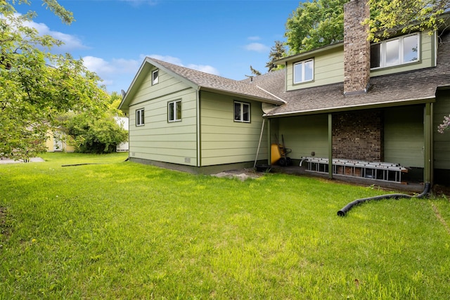 226 S Davis St, Missoula, MT 59801 - view of home's exterior featuring a yard, roof with shingles, and a chimney