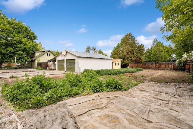 226 S Davis St, Missoula, MT 59801 - view of property exterior featuring an outbuilding, a detached garage, and a metal roof