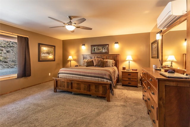 bedroom featuring a ceiling fan, baseboards, light carpet, and a wall mounted air conditioner