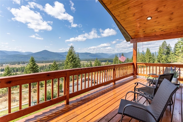wooden terrace with a mountain view