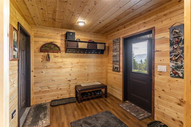 doorway to outside with wooden walls, wooden ceiling, and wood finished floors