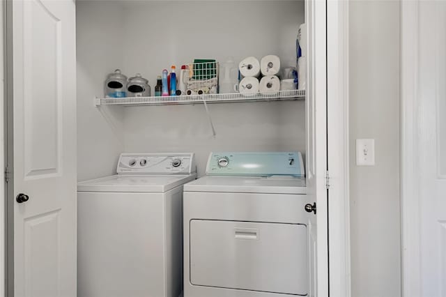 clothes washing area with laundry area and washer and dryer