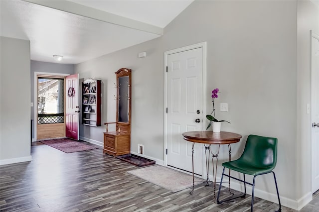 entrance foyer featuring baseboards and wood finished floors