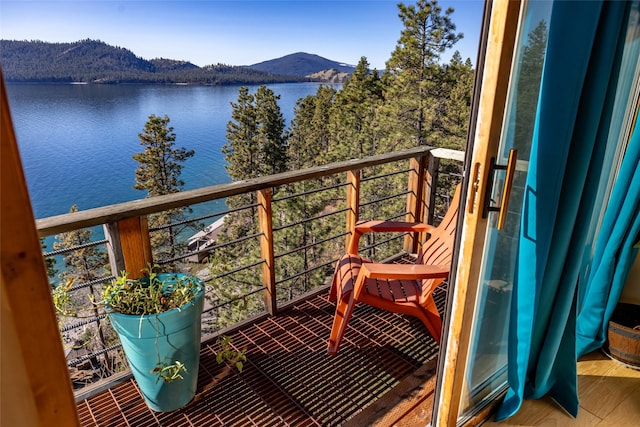 balcony with a water and mountain view