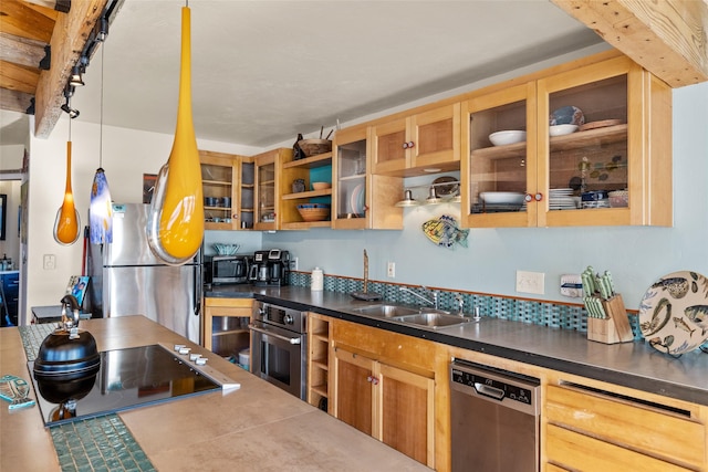 kitchen with backsplash, a sink, track lighting, glass insert cabinets, and stainless steel appliances