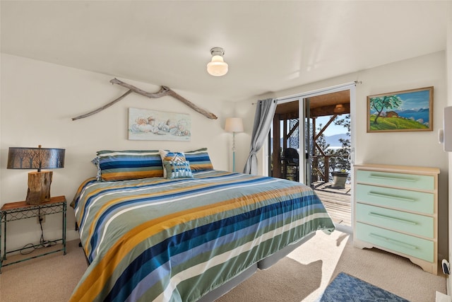 bedroom with carpet and access to exterior