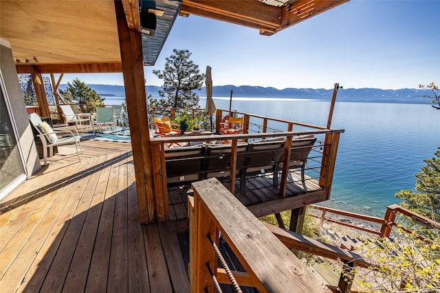 exterior space featuring a water and mountain view
