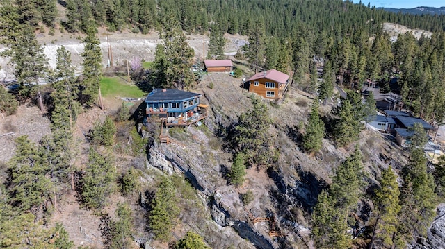 bird's eye view featuring a forest view