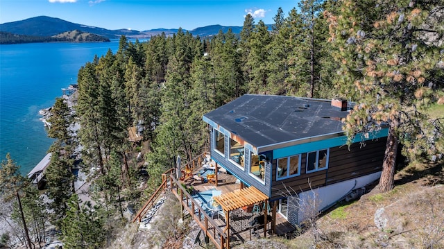 bird's eye view with a water and mountain view