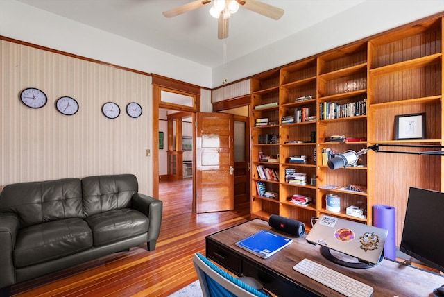 office space with a ceiling fan and wood finished floors