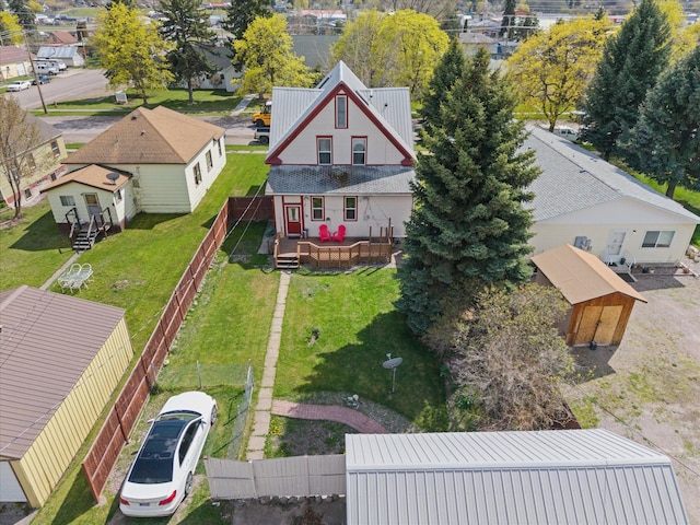 birds eye view of property with a residential view