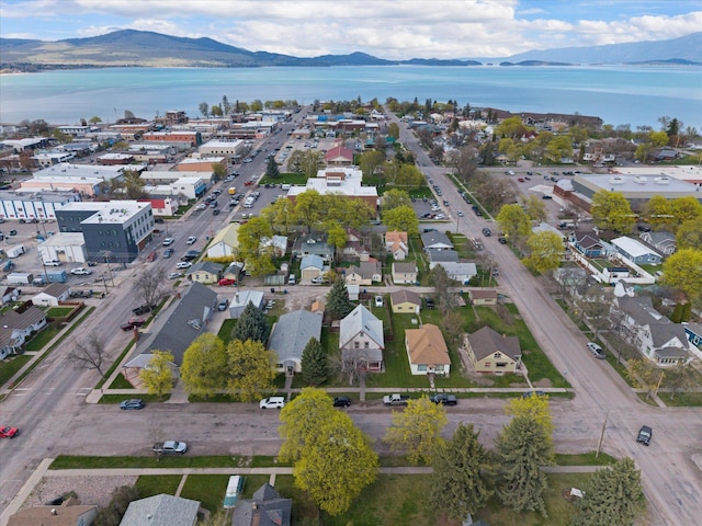 drone / aerial view featuring a water and mountain view