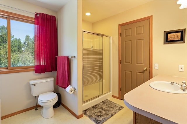 19720 Leo Hansen Rd, Florence, MT 59833 - bathroom featuring toilet, plenty of natural light, a sink, and a stall shower