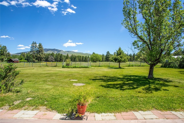 19720 Leo Hansen Rd, Florence, MT 59833 - view of yard with a rural view, fence, and a mountain view