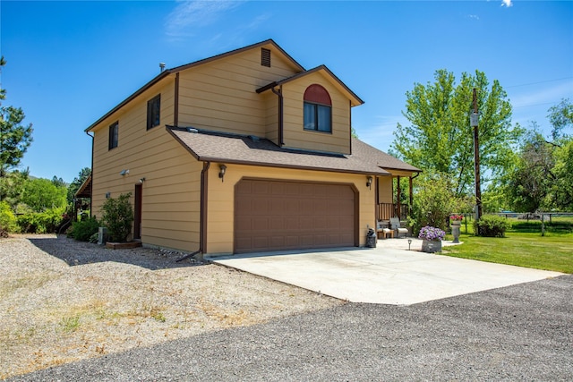 19720 Leo Hansen Rd, Florence, MT 59833 - view of front facade featuring an attached garage, driveway, and a shingled roof