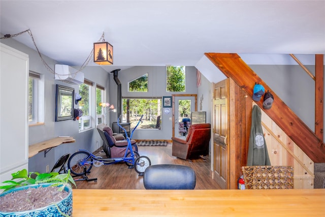 interior space with lofted ceiling and wood finished floors