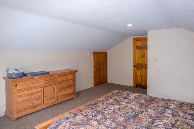 carpeted bedroom with vaulted ceiling