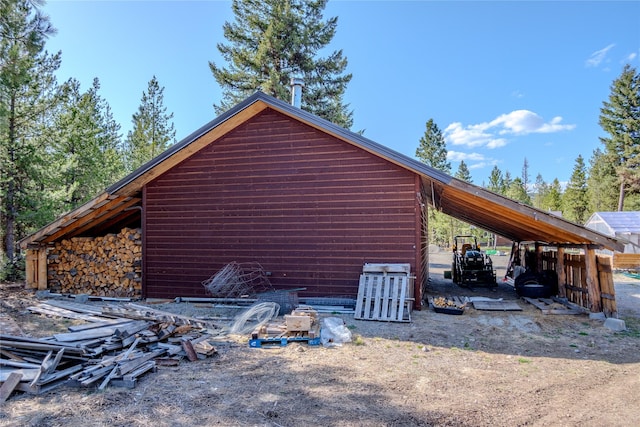 view of property exterior with a carport