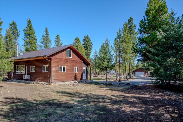 view of side of property with metal roof