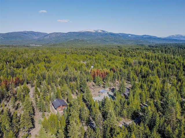 bird's eye view with a mountain view and a wooded view