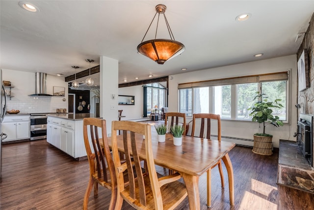 dining room featuring a baseboard heating unit, recessed lighting, and dark wood-type flooring