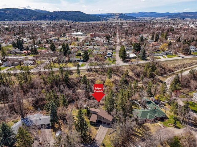 birds eye view of property with a residential view and a mountain view